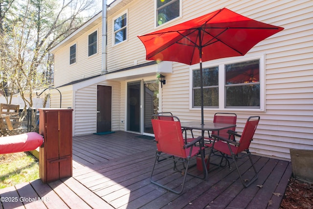 deck featuring outdoor dining area