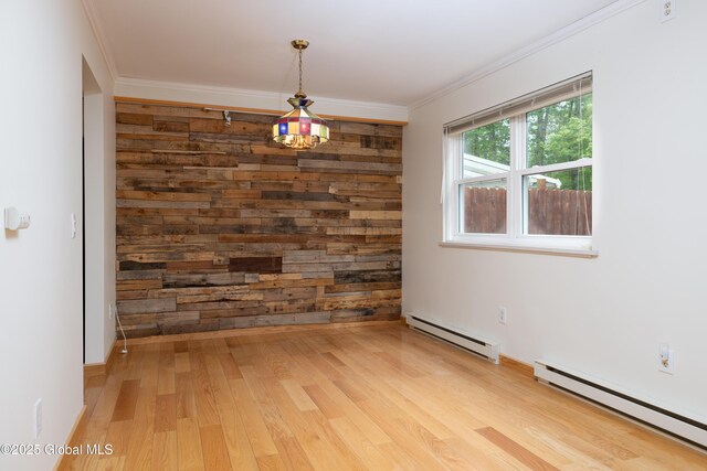 26 Queens Way, Queensbury, NY 12804 - spare room with a baseboard radiator, baseboard heating, light wood finished floors, crown molding, and baseboards