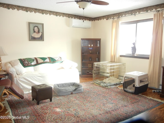 bedroom featuring a wall mounted air conditioner and hardwood / wood-style floors