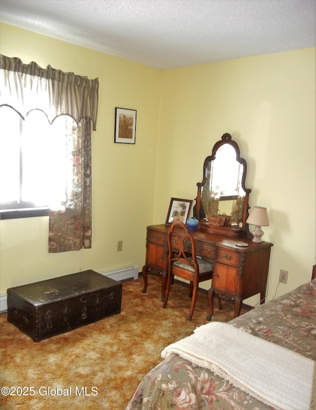 bedroom featuring baseboard heating, carpet, and a textured ceiling