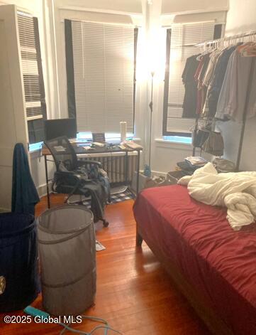 bedroom featuring wood-type flooring