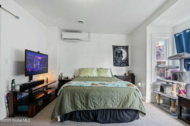 carpeted bedroom featuring a wall unit AC