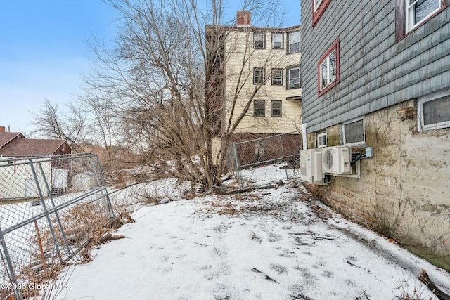 snowy yard with ac unit