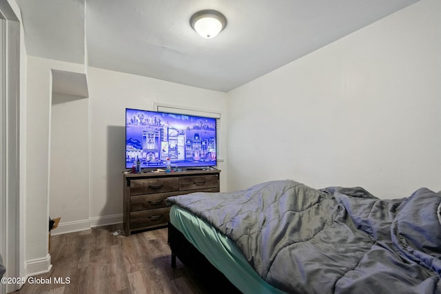 bedroom featuring dark hardwood / wood-style floors