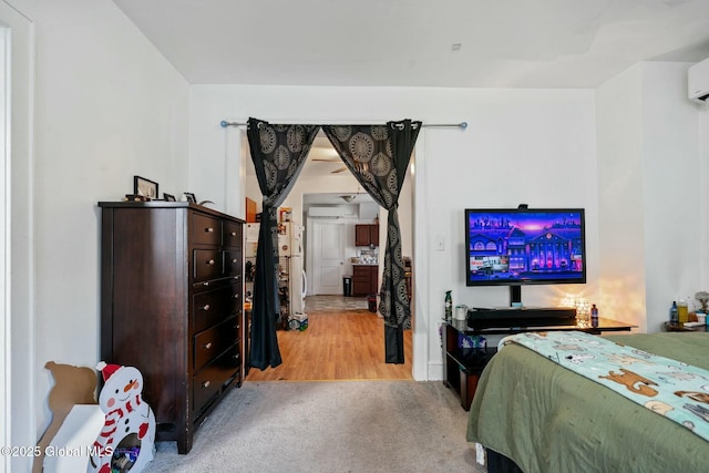 carpeted bedroom featuring an AC wall unit