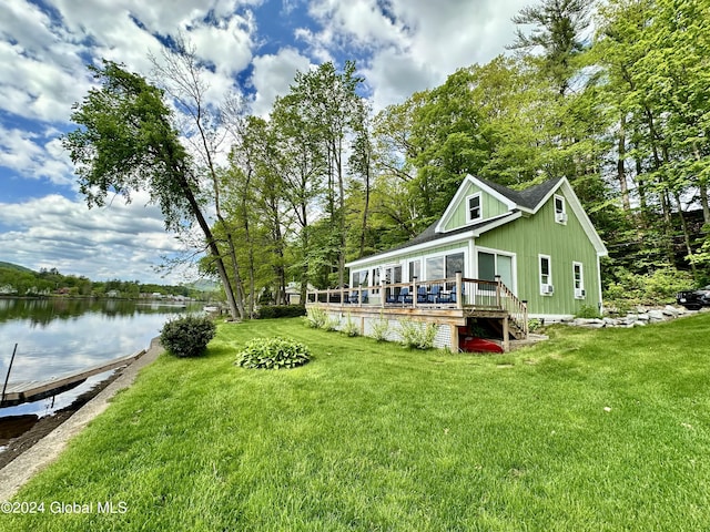 view of yard featuring a deck with water view