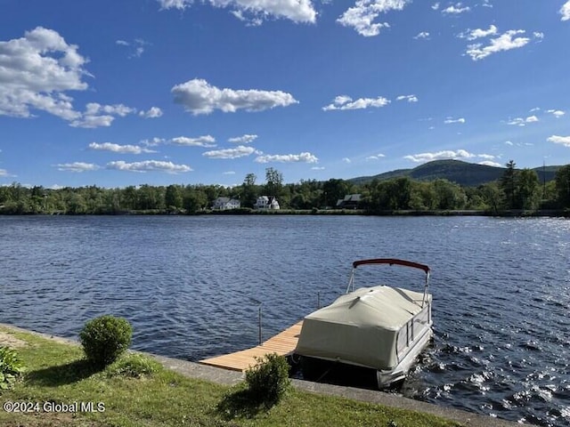 dock area featuring a water and mountain view