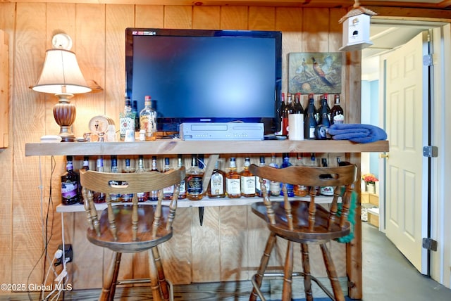 bar featuring concrete floors