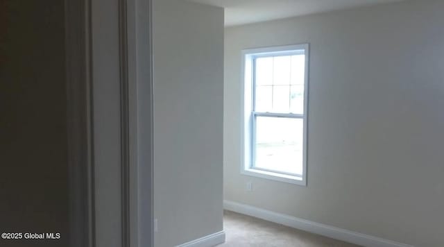 empty room featuring light carpet