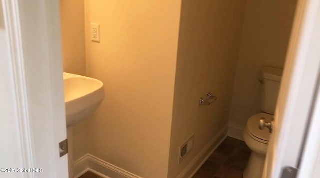 bathroom featuring toilet