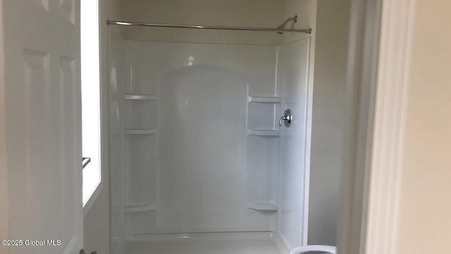 bathroom featuring walk in shower