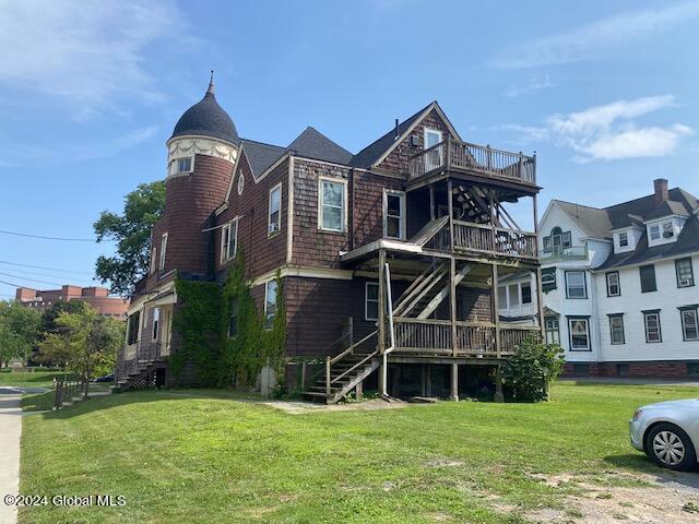 exterior space with a yard and a deck