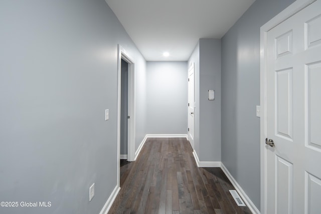 corridor featuring dark hardwood / wood-style flooring