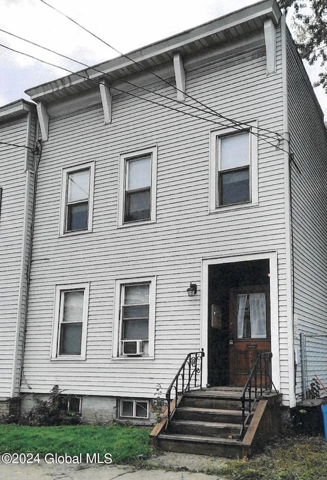 view of front facade with cooling unit