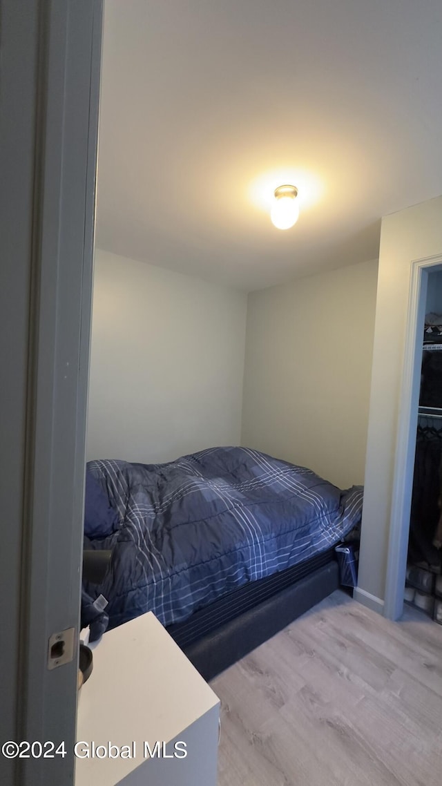 bedroom with light hardwood / wood-style flooring