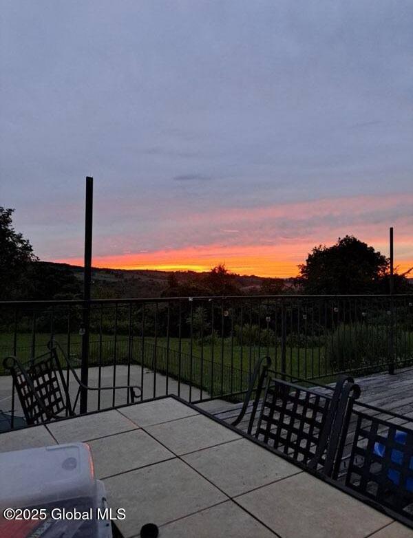 view of patio terrace at dusk