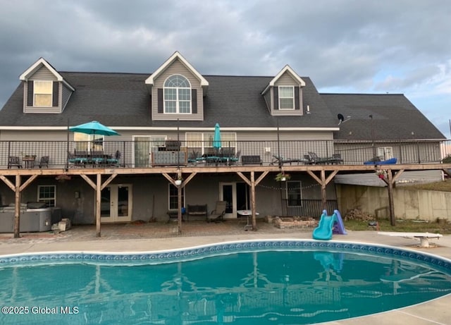 rear view of property featuring a patio