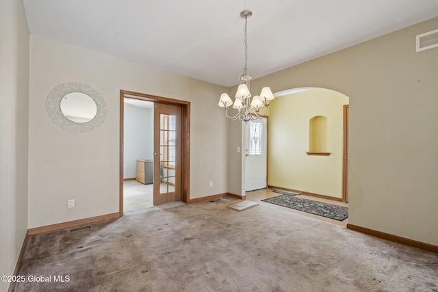 interior space featuring light colored carpet and a notable chandelier