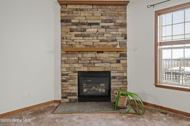 room details featuring carpet floors and a fireplace