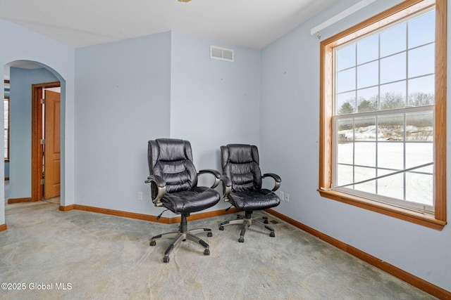 living area with light carpet