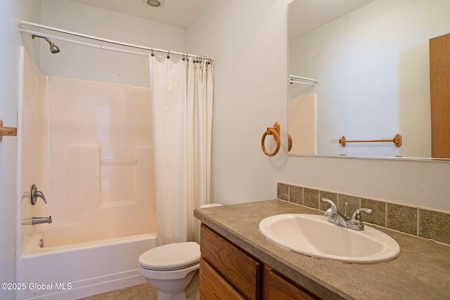 full bathroom with vanity, shower / bath combination with curtain, and toilet