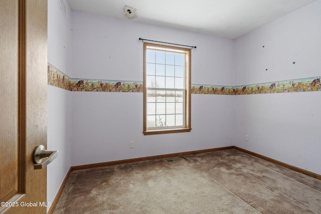 spare room featuring carpet floors