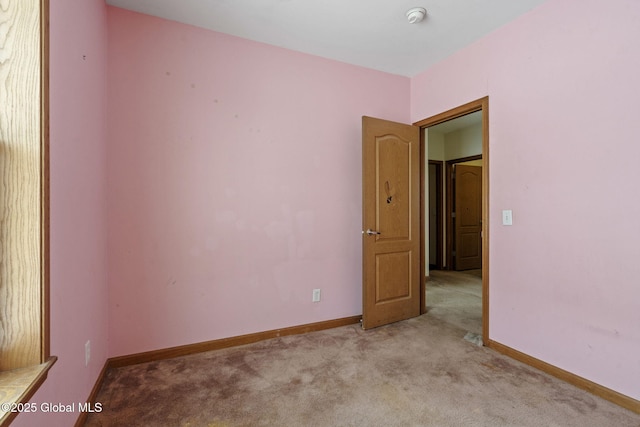 empty room with light colored carpet