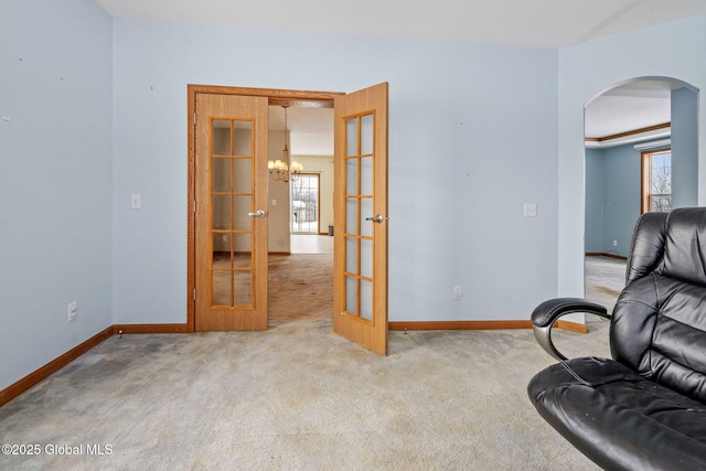 carpeted living room with french doors and a healthy amount of sunlight