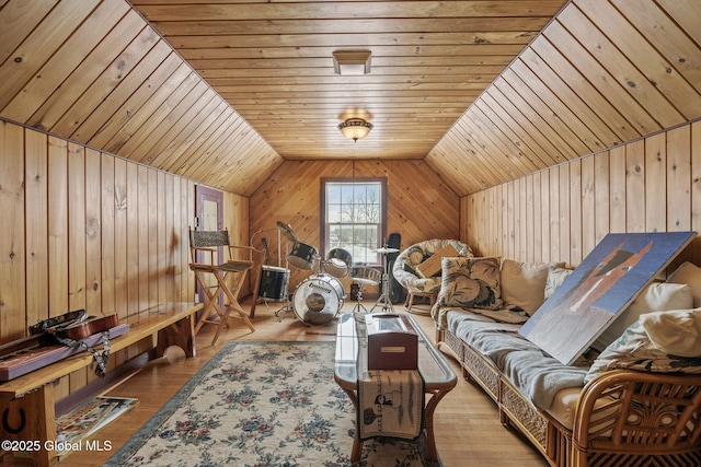 bonus room with lofted ceiling, wood ceiling, wooden walls, and light hardwood / wood-style floors