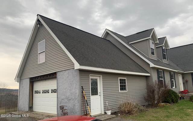 view of side of home with a garage