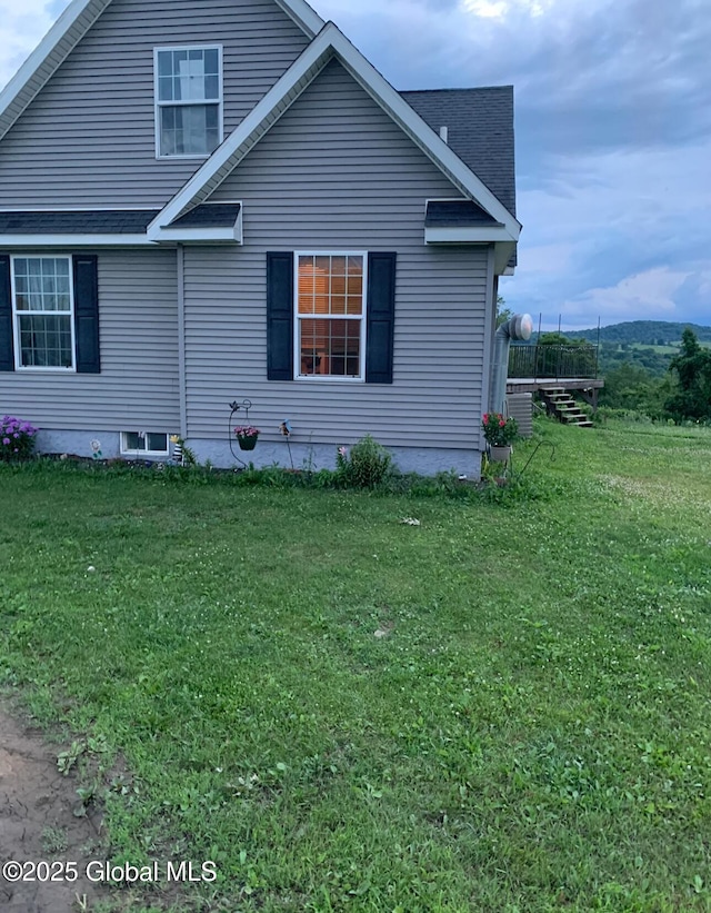 view of home's exterior featuring a lawn