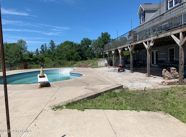 view of swimming pool with a patio