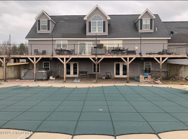 view of pool with a patio, a jacuzzi, and french doors