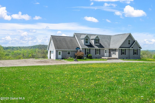 220 Anderson Cir, Fort Plain, NY 13339 - new england style home featuring a front yard, driveway, and a garage