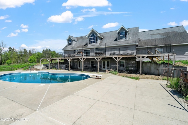 220 Anderson Cir, Fort Plain, NY 13339 - view of swimming pool featuring a patio, french doors, a diving board, fence, and a wooden deck