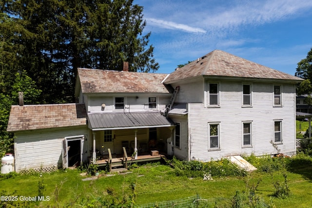 1673 County Route 64, Salem, NY 12865 - back of house with a chimney, covered porch, and a yard