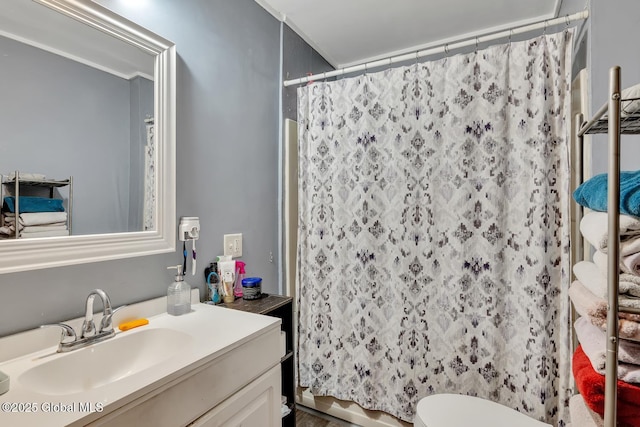 bathroom with vanity, toilet, and a shower with shower curtain