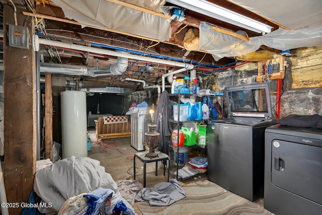 basement featuring water heater and washing machine and dryer