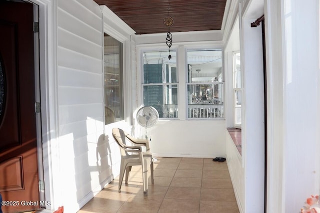 sunroom / solarium featuring wooden ceiling