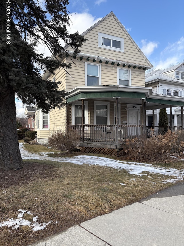 view of front of property featuring covered porch