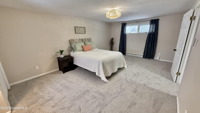 carpeted bedroom featuring baseboard heating