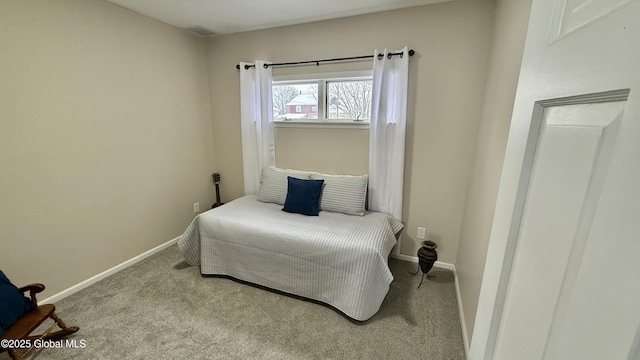 bedroom with light carpet