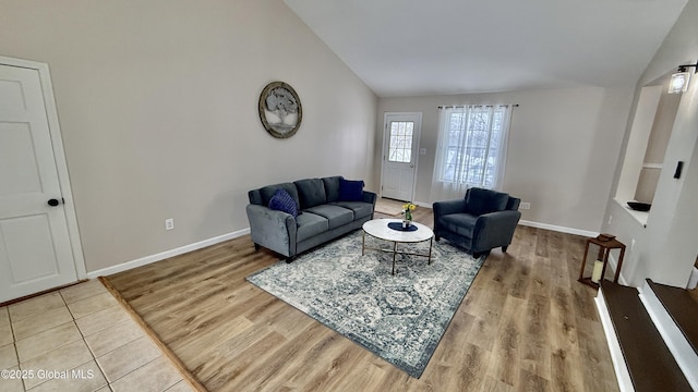 living room featuring hardwood / wood-style flooring and lofted ceiling