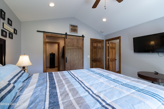 bedroom with recessed lighting, a barn door, ceiling fan, and vaulted ceiling