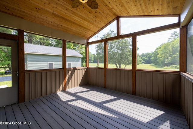 unfurnished sunroom featuring wooden ceiling, ceiling fan, and vaulted ceiling