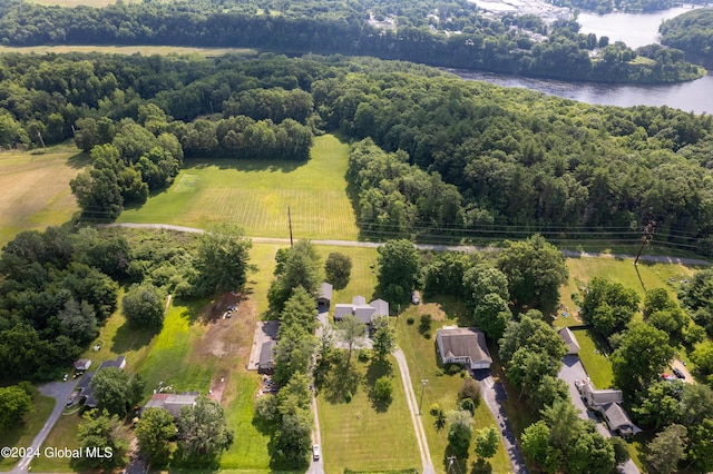 bird's eye view featuring a view of trees and a water view