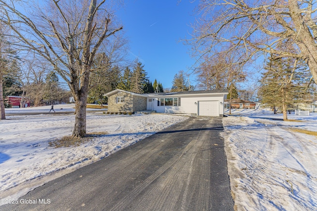 ranch-style house featuring a garage