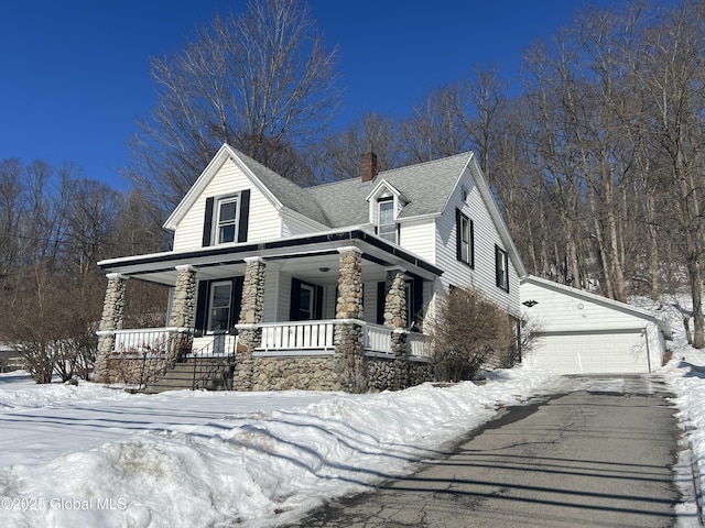 view of front of property with a garage and covered porch