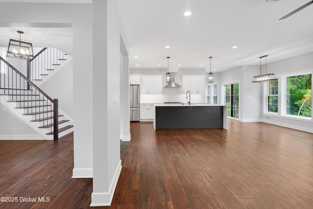 722 Swaggertown Rd, Glenville, NY 12302 - unfurnished living room featuring baseboards, dark wood finished floors, a sink, recessed lighting, and stairs