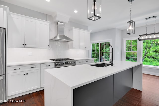 722 Swaggertown Rd, Glenville, NY 12302 - kitchen featuring wall chimney exhaust hood, a sink, a kitchen island with sink, tasteful backsplash, and recessed lighting